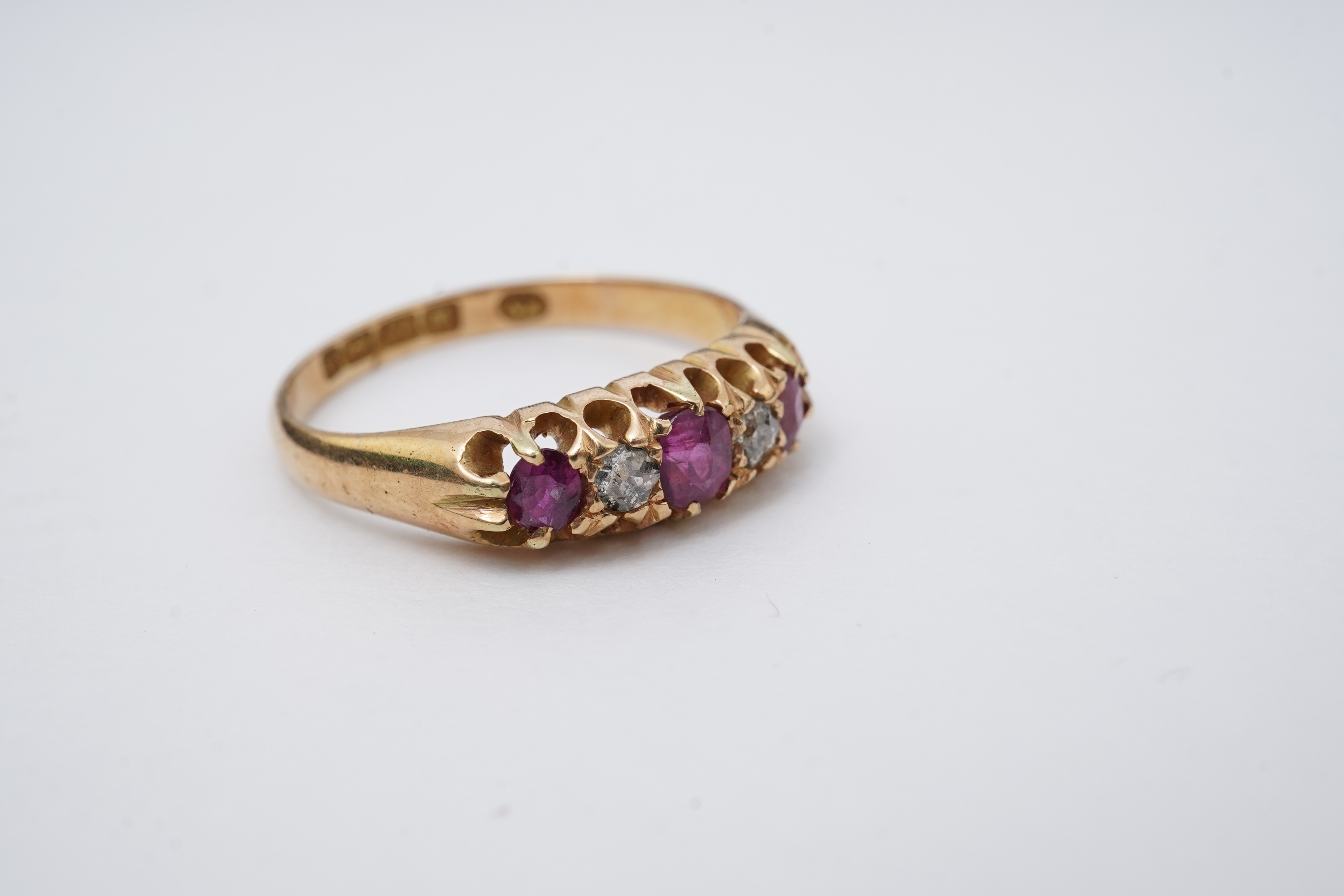 A ruby and diamond five-stone ring, circa 1900